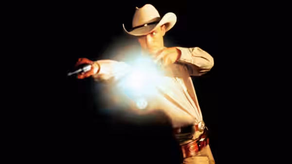 Buddy Deeds (Matthew McConaughey) firing a revolver in darkness