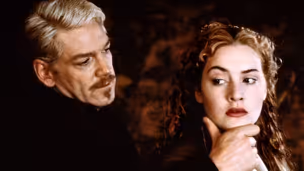 Prince Hamlet (Kenneth Branagh) touching Ophelia (Kate Winslet) on the chin