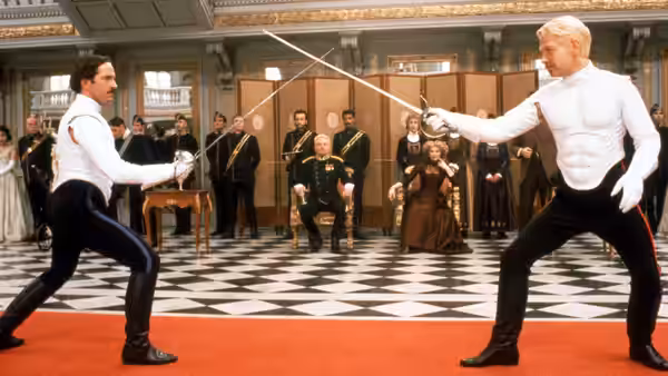 Prince Hamlet (Kenneth Branagh) fencing against Laertes (Michael Maloney) in a hall
