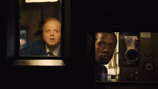 Stephen (Micheal Ward) peers through a projection-room window as a man watches from another room