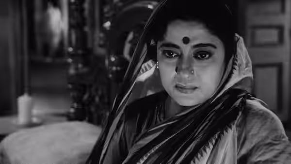 Mahamaya Roy (Padma Devi) looks down beneath her sari veil