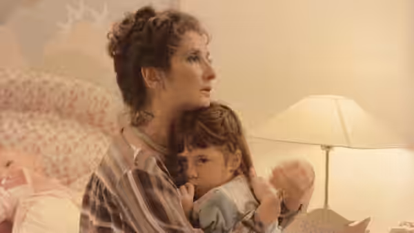 Alicia (Norma Aleandro) sits on a bed holding Gaby in her arms