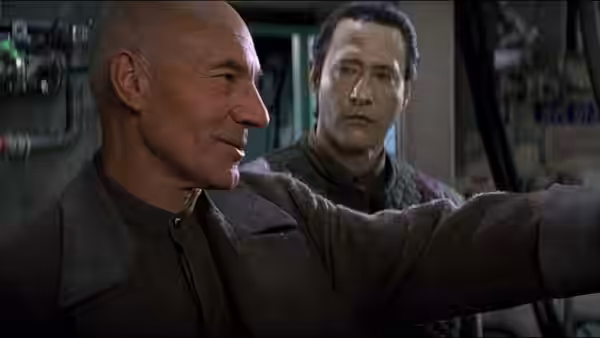 Picard (Patrick Stewart) points ahead with Data (Brent Spiner) behind him