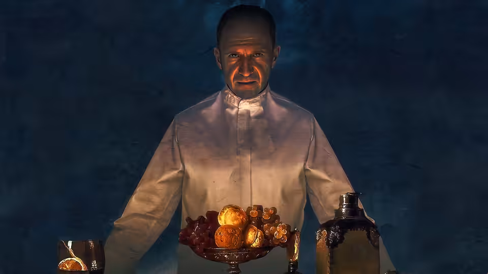 Chef Slowik (Ralph Fiennes) presents a dish at the restaurant counter