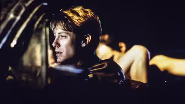 James Ballard (James Spader) sits inside car at night