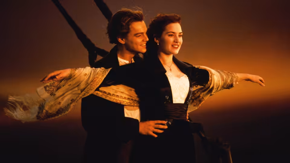 Jack Dawson (Leonardo DiCaprio) and Rose DeWitt Bukater (Kate Winslet) stand at the bow with arms outstretched
