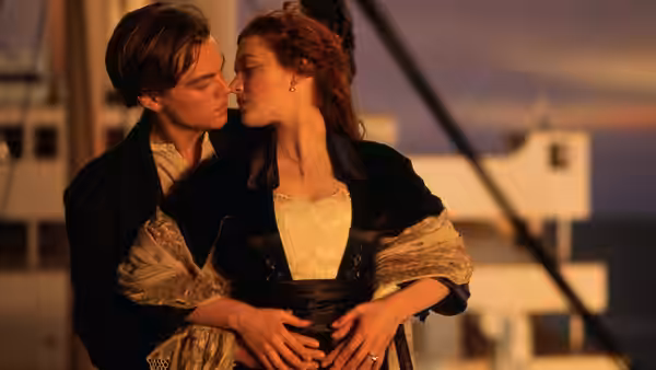 Jack Dawson (Leonardo DiCaprio) and Rose DeWitt Bukater (Kate Winslet) embrace closely on the deck