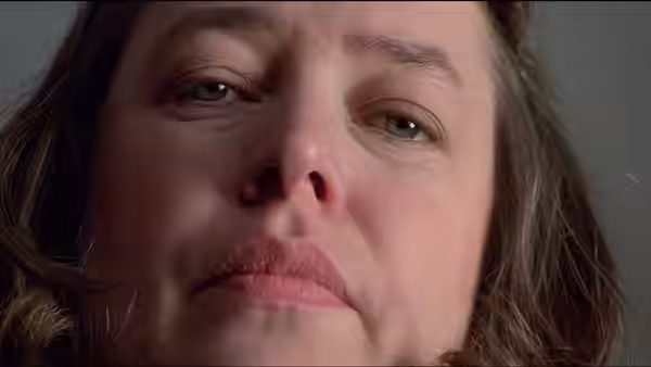 Annie Wilkes (Kathy Bates) with a concerned expression on her face