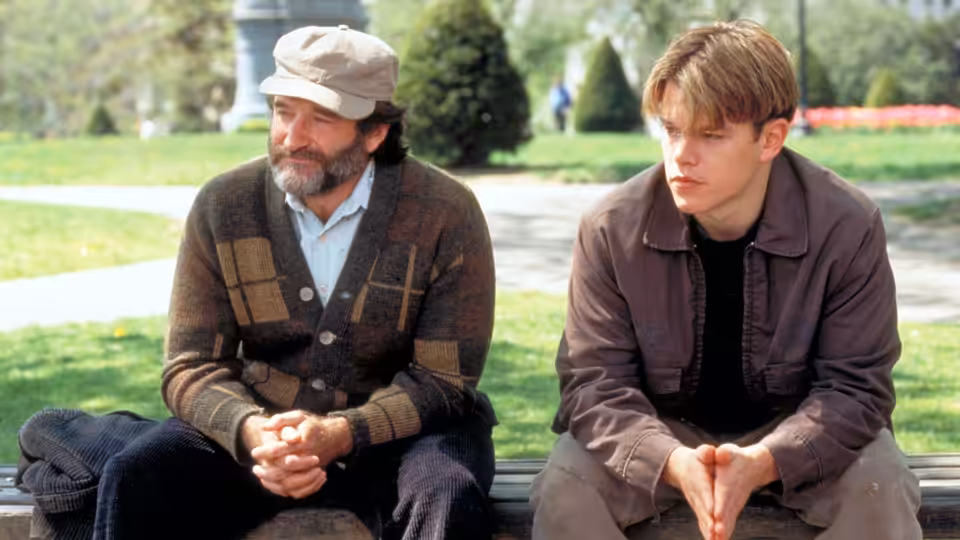Will Hunting (Matt Damon) and Sean Maguire (Robin Williams) sitting on a park bench