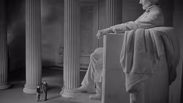 Two small figures stand beside a giant seated figure between tall columns