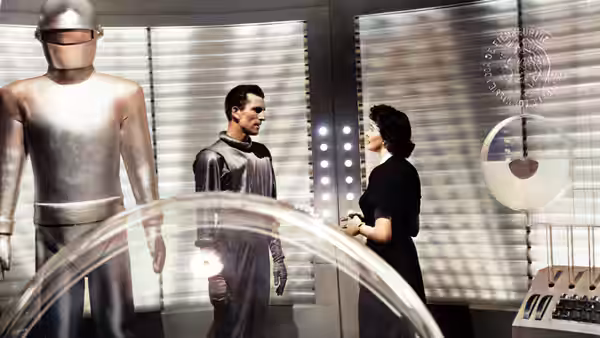 Klaatu (Michael Rennie) and Helen Benson (Patricia Neal) talk beside Gort in a spacecraft