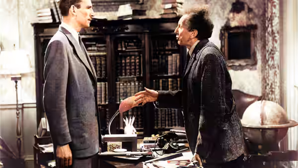 Klaatu (Michael Rennie) shakes hands with Professor Barnhardt (Sam Jaffe) in his study