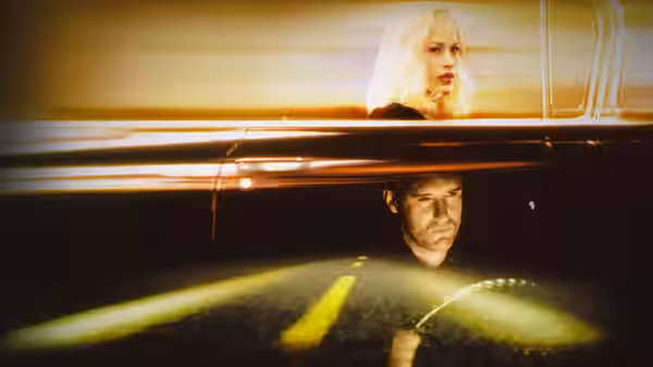 Renee Madison (Patricia Arquette) in a car at night with Fred Madison (Bill Pullman)