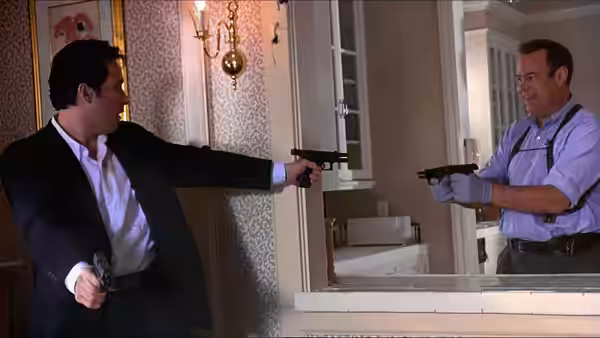 two armed men pointing guns at each other across a kitchen counter