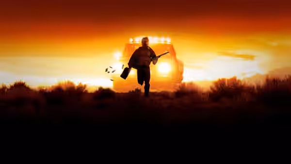 A man runs across open land toward a vehicle at sunset carrying a briefcase and rifle