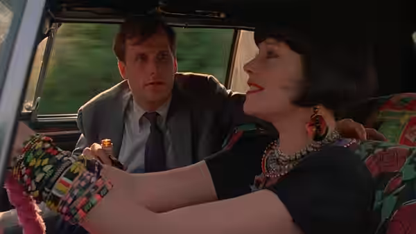 Audrey Hankel rests her feet up while Charles Driggs drives the car