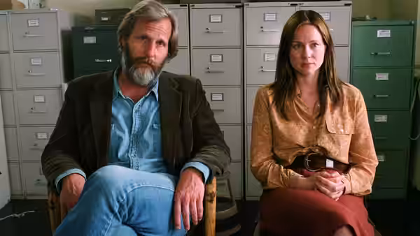 Bernard (Jeff Daniels) and Joan (Laura Linney) seated together in an office