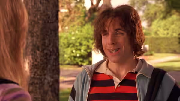 Ted (Ben Stiller) smiling at a woman while standing outdoors