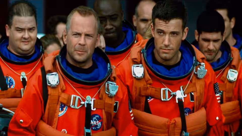 Harry Stamper (Bruce Willis) and A.J. Frost (Ben Affleck) in orange NASA spacesuits with their team