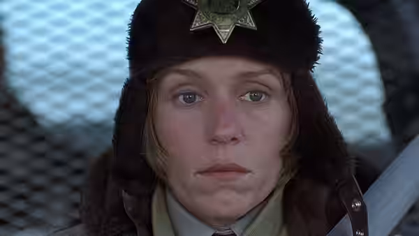 Marge Gunderson (Frances McDormand) in close-up wearing a fur hat