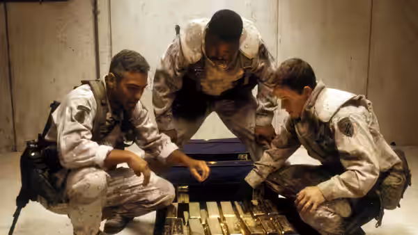 Archie Gates (George Clooney), Chief Elgin (Ice Cube) and Troy Barlow (Mark Wahlberg) inspect gold bars