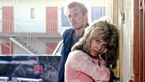 Sarah Connor (Linda Hamilton) and Kyle Reese (Michael Biehn) pressed against a wall