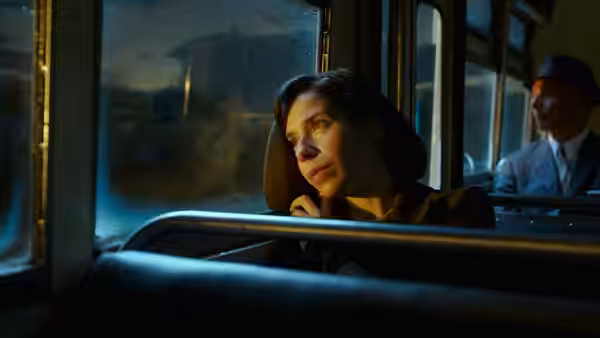 Elisa Esposito (Sally Hawkins) rides a bus and looks out the window