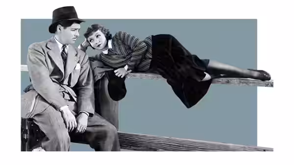 Ellie Andrews (Claudette Colbert) reclines on a railing near Peter Warne (Clark Gable)