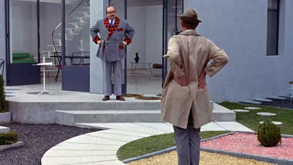 Monsieur Hulot faces Monsieur Arpel across the geometric garden of the Arpel home