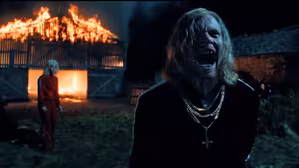 Sir Jimmy Crystal (Jack O'Connell) screaming before a burning barn at night