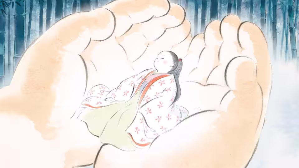 tiny child in floral robe resting in large open hands among bamboo