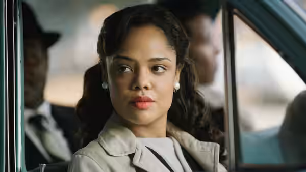 Coretta Scott King (Carmen Ejogo) looking ahead from inside a car