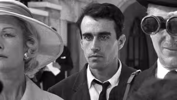 Michel (Martin LaSalle) stands among passengers, flanked by a woman in a hat and a man wearing goggles