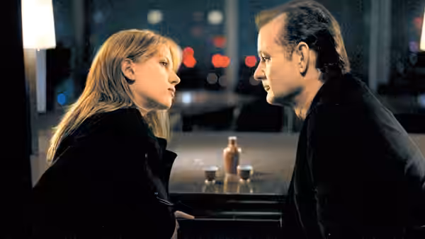 Bob Harris (Bill Murray) and Charlotte (Scarlett Johansson) sitting at a bar