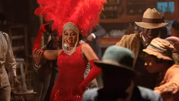 Shug Avery (Taraji P. Henson) performs in a red dress before a crowd