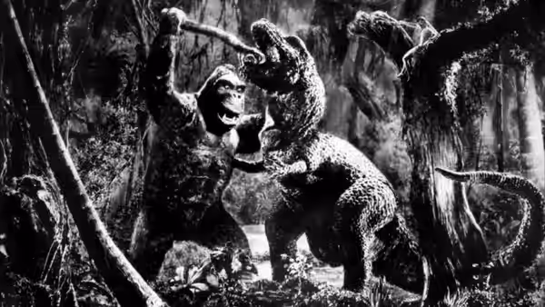 King Kong battling a dinosaur in a dense jungle