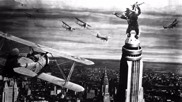 King Kong on the Empire State Building swatting at airplanes