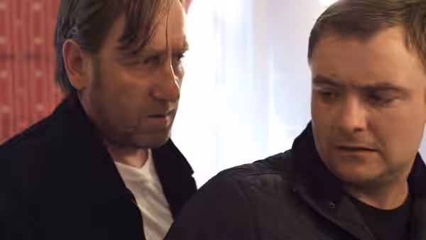 Gal (Michael Smiley) and Jay (Neil Maskell) stand close indoors