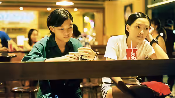Ting-Ting and Lili sit together at a restaurant table with drinks