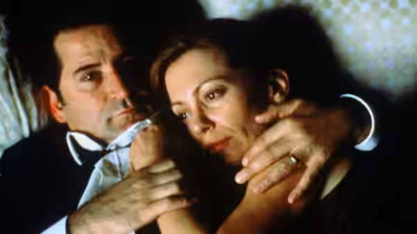 Leon Zat (Anthony LaPaglia) holds Sonja close as they sit together