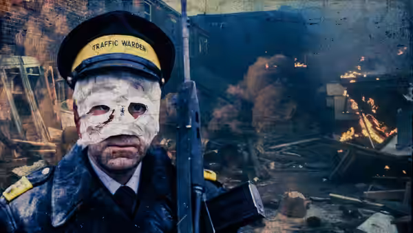 A traffic warden in uniform holding a rifle amid burning destroyed buildings