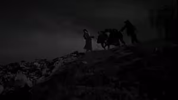 Two figures guiding a donkey over a rocky hillside at night