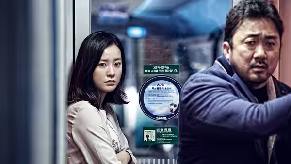 Sung-gyeong (Jung Yu-mi) and Sang-hwa (Ma Dong-seok) stand by the window