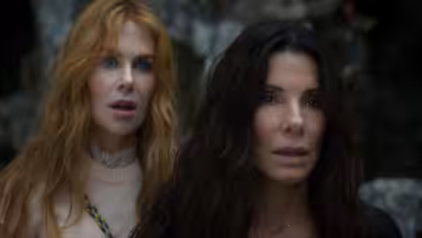 Nicole Kidman and Sandra Bullock standing outdoors with surprised expressions