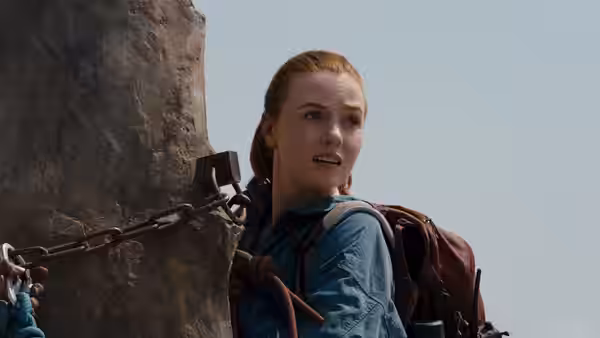 Shiloh Hunter (Virginia Gardner) looks upward while chained to a rocky pillar