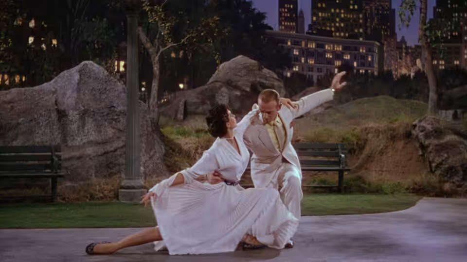 Tony Hunter (Fred Astaire) and Gabrielle Gerard (Cyd Charisse) dance together on an outdoor stage