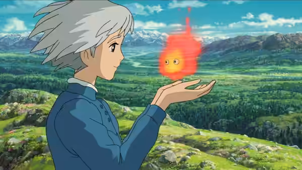 Howl (Takuya Kimura) holding Calcifer (Tatsuya Gashūin) above a green valley