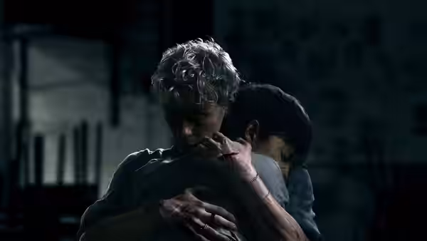 Ryan Whelan (Stacy Clausen) holding Naim Reid (Joe Bird) in a tight embrace