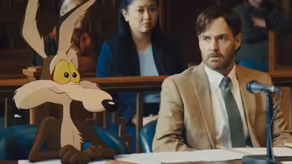 Will Forte as Kevin Avery seated in court beside Wile E. Coyote