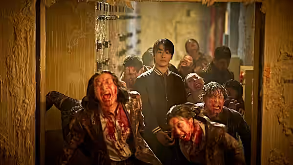 man screaming on the floor of a narrow damaged corridor